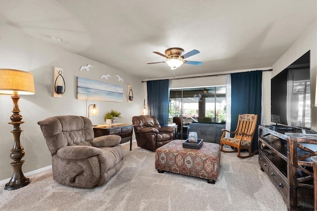 living room with carpet floors and ceiling fan