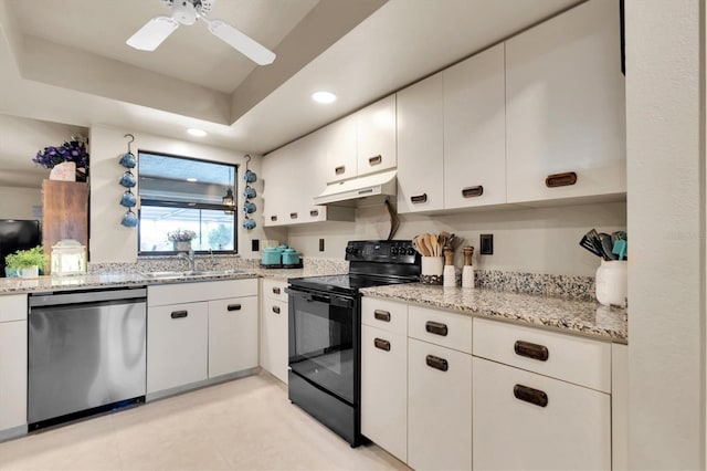 kitchen with black electric range oven, sink, dishwasher, a tray ceiling, and white cabinets