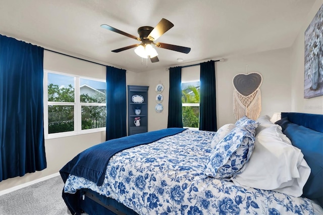 bedroom featuring ceiling fan and carpet floors