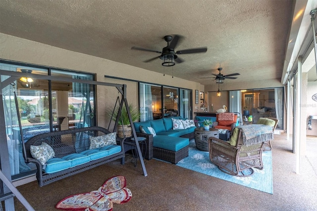 view of patio featuring an outdoor living space and ceiling fan