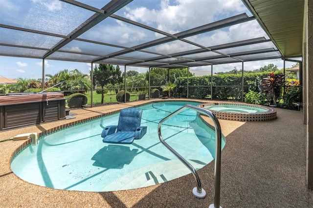 view of swimming pool featuring an in ground hot tub, a patio area, and glass enclosure