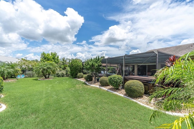 view of yard featuring a lanai