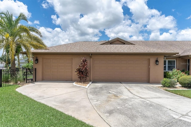 single story home featuring a garage