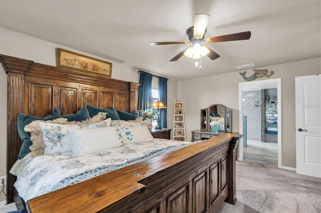 bedroom with light carpet, baseboards, visible vents, and ceiling fan