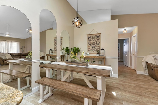 dining space featuring ceiling fan and lofted ceiling