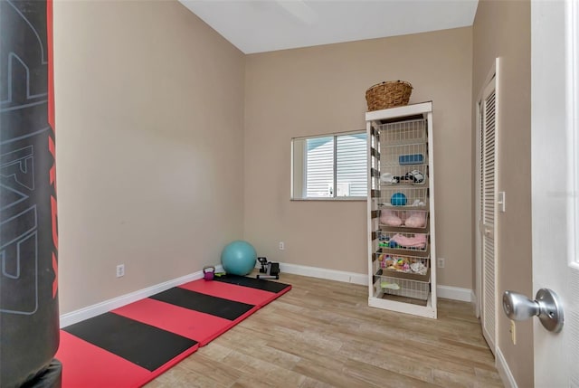 exercise area with light hardwood / wood-style floors