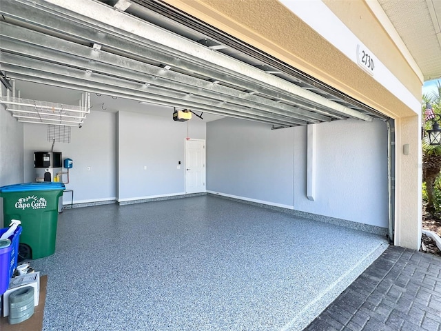 garage featuring a garage door opener