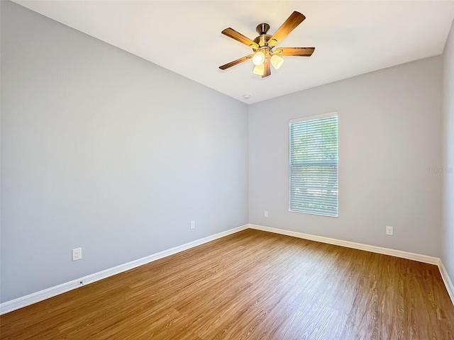 spare room featuring ceiling fan and wood-type flooring