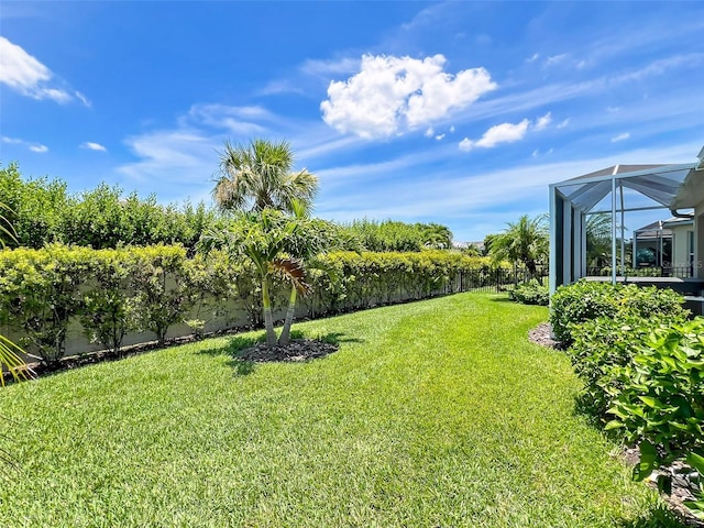 view of yard featuring a lanai