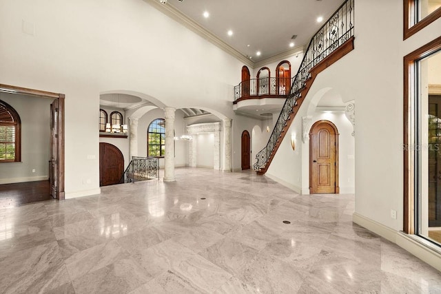 interior space featuring ornate columns and high vaulted ceiling