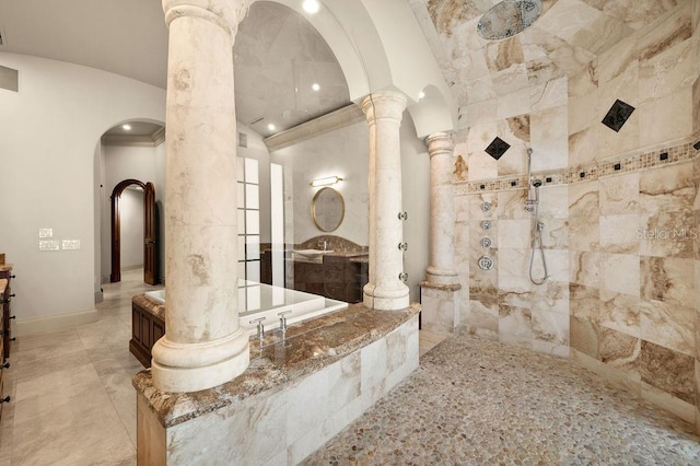 bathroom featuring ornate columns, plus walk in shower, lofted ceiling, and tile patterned floors