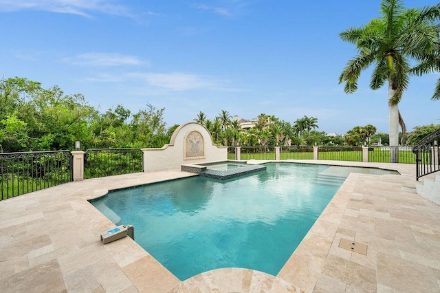 view of swimming pool featuring an in ground hot tub