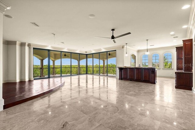 interior space with light tile patterned flooring, crown molding, and ceiling fan