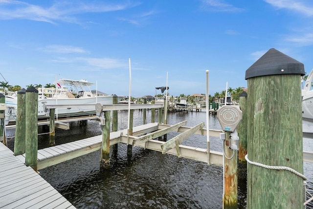 view of dock featuring a water view and boat lift