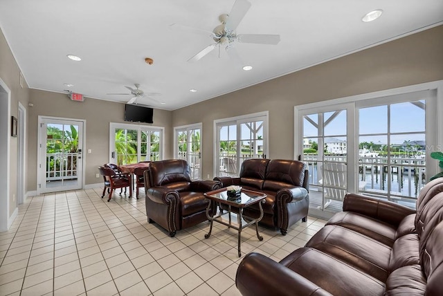 tiled living room with ceiling fan