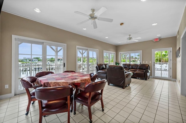 tiled dining space with ceiling fan