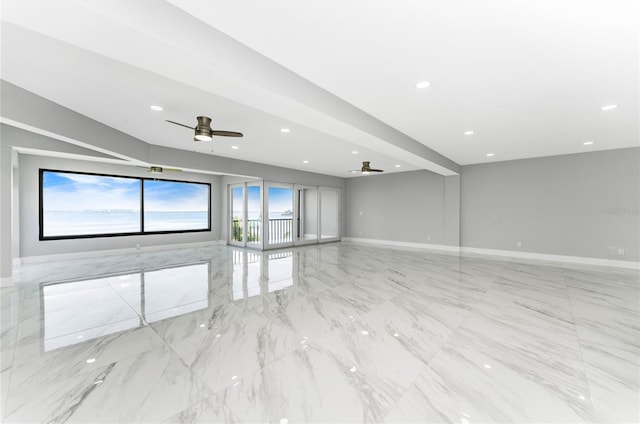 unfurnished living room with ceiling fan