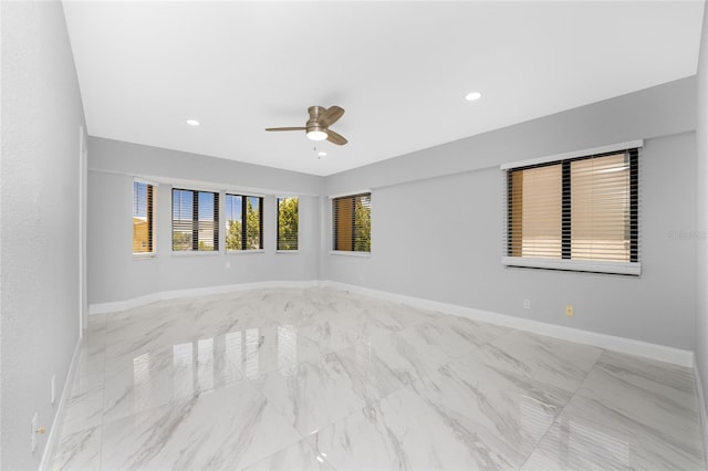 unfurnished room with ceiling fan