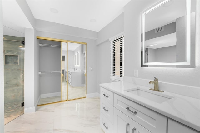 bathroom with vanity and an enclosed shower