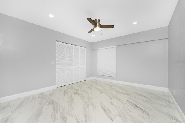 unfurnished bedroom featuring ceiling fan and a closet