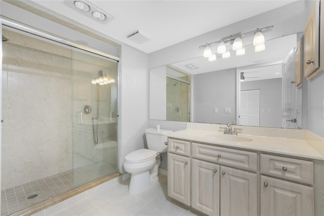 bathroom with vanity, tile patterned flooring, ceiling fan, toilet, and an enclosed shower