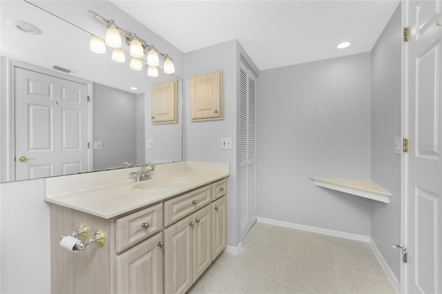 bathroom with tile patterned flooring and vanity