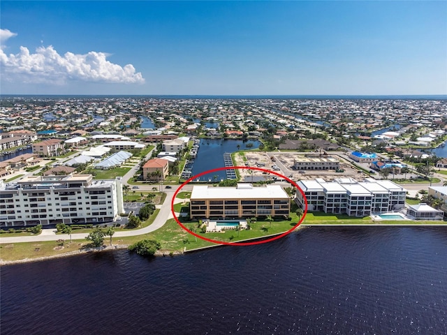 birds eye view of property featuring a water view