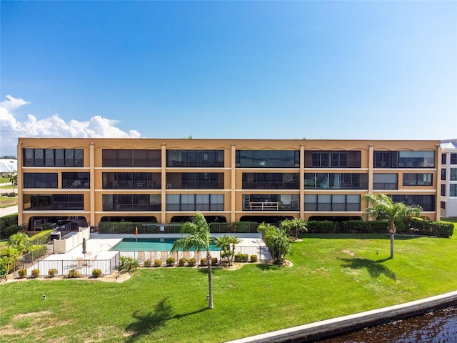 view of property featuring a community pool