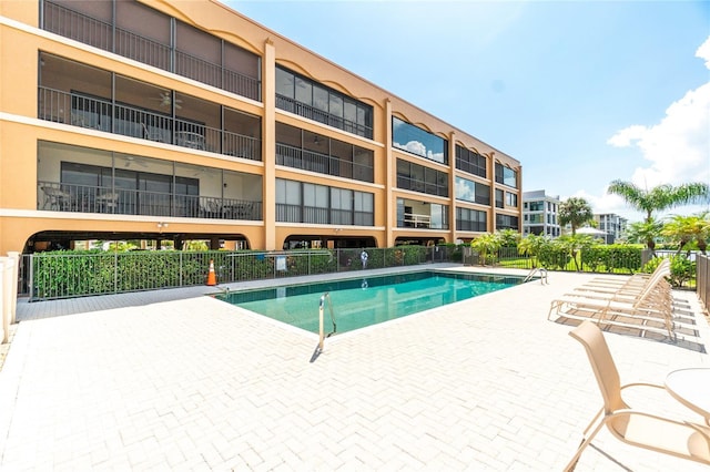 view of swimming pool featuring a patio