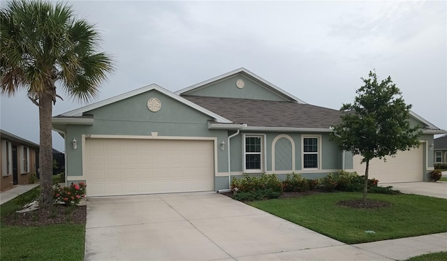 ranch-style house with a garage and a front lawn