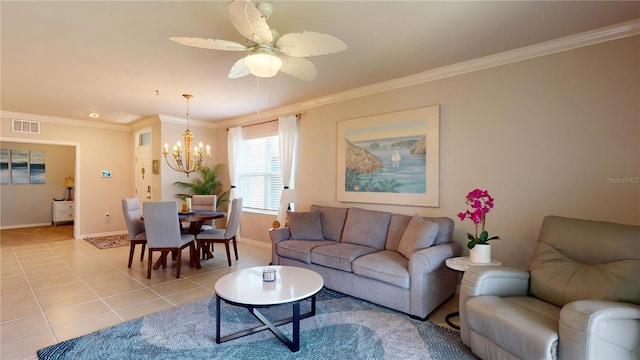 living room with tile patterned flooring, ceiling fan with notable chandelier, and ornamental molding