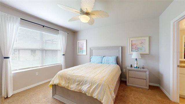 bedroom featuring light carpet and ceiling fan