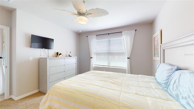 bedroom with light carpet and ceiling fan