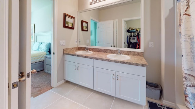 bathroom featuring dual vanity and tile patterned floors