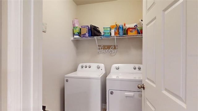 washroom featuring washing machine and dryer