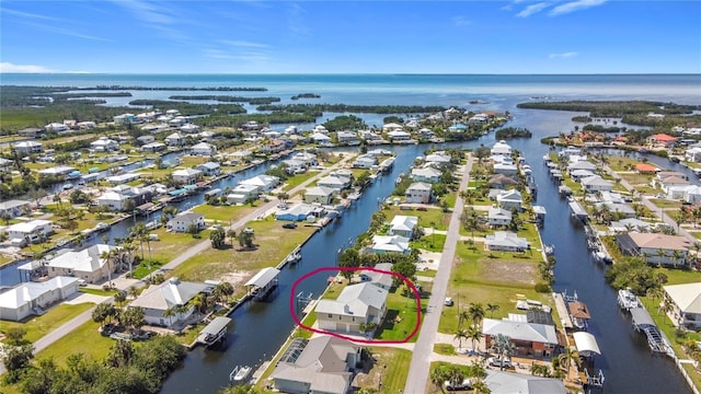 aerial view featuring a water view and a residential view