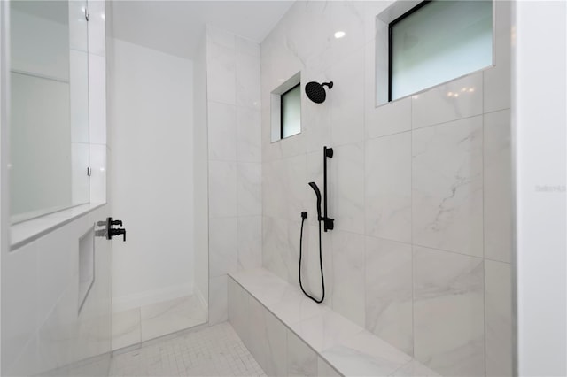 bathroom with tiled shower