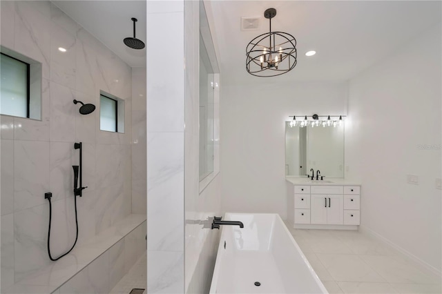 bathroom featuring tile patterned floors, vanity, a notable chandelier, and shower with separate bathtub