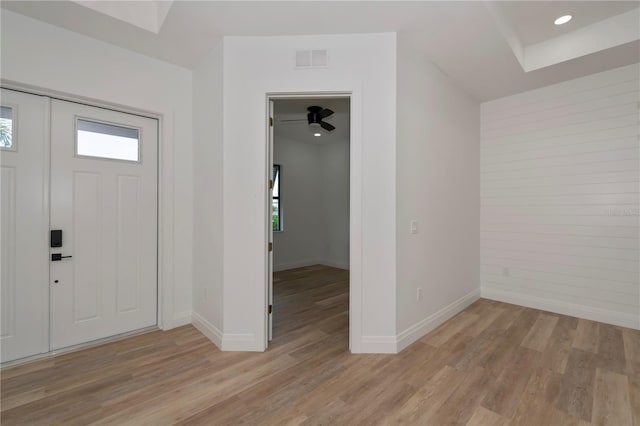 entrance foyer with ceiling fan and light hardwood / wood-style flooring