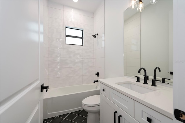 full bathroom with tile patterned floors, tiled shower / bath combo, toilet, and vanity