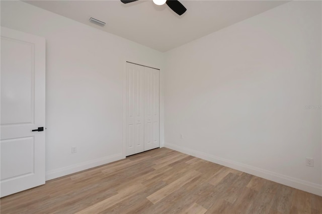 empty room featuring light hardwood / wood-style floors and ceiling fan