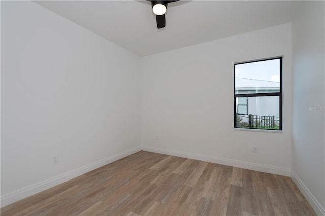 unfurnished room featuring ceiling fan and light hardwood / wood-style floors