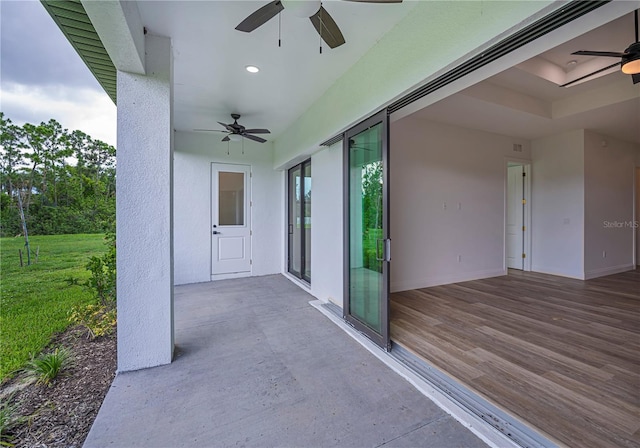 view of patio / terrace with ceiling fan and a wooden deck