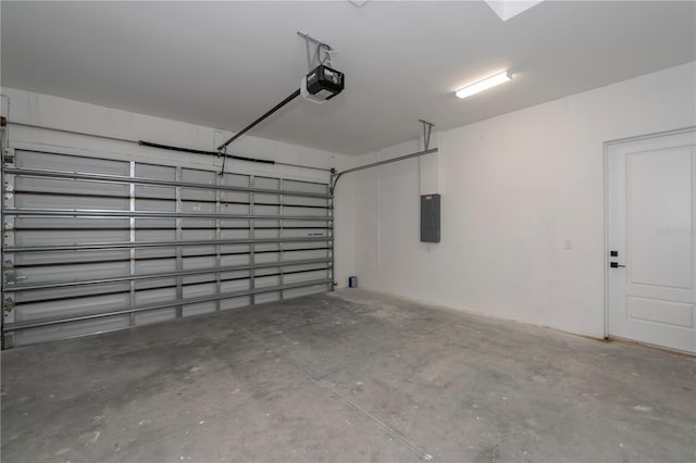 garage featuring electric panel and a garage door opener