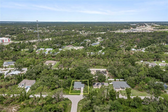 aerial view with a wooded view