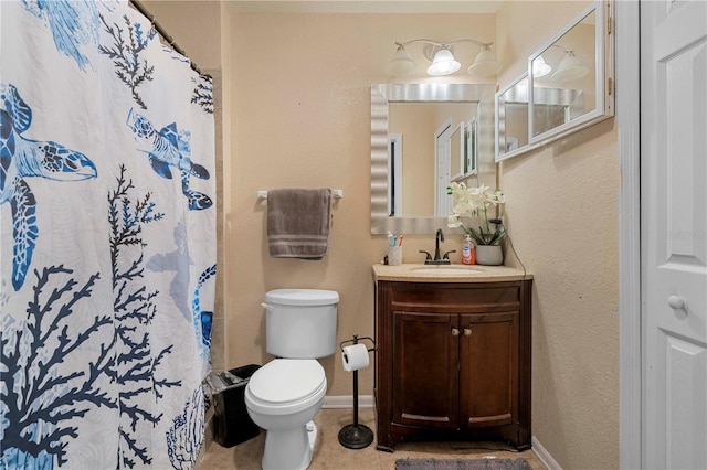 bathroom with tile patterned floors, vanity, baseboards, toilet, and a shower with shower curtain
