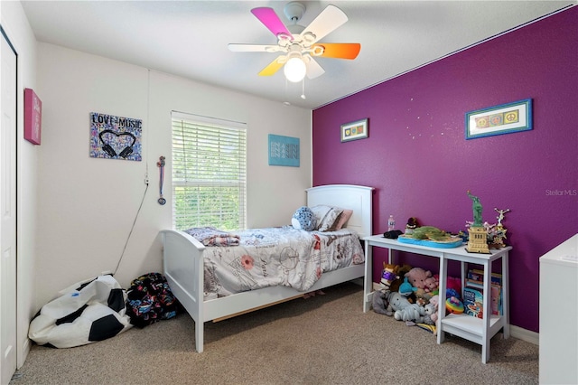 carpeted bedroom with a ceiling fan