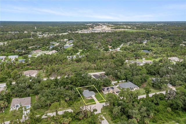 aerial view featuring a wooded view
