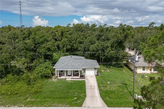 drone / aerial view featuring a forest view