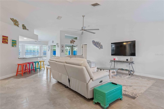 living room featuring ceiling fan and high vaulted ceiling